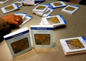 Copies of Pope Francis's encyclical, a collection of principles to guide Catholic teaching, entitled "Laudato Si " lies on a table during its official presentation at the Sinod hall in the Vatican, 18 June 2015.   ANSA/ALESSANDRO DI MEO