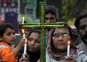 Pakistani Christians hold candles during vigil for the victims of Sunday's suicide bombing, at close to bombing's site in Lahore, Pakistan, Tuesday, March 29, 2016. The government had vowed to crack down on extremism after a suicide bomber targeted Christians celebrating Easter in Lahore, killing more than 70 people. The attack was claimed by a breakaway Taliban faction that supports the Islamic State group. (AP Photo/K.M. Chaudary)