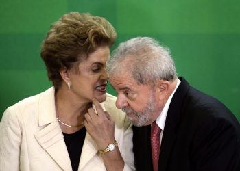 epa05216371 President of Brazil, Dilma Rousseff (L) with her predecessor, Former President of Brazil, Luiz Inacio Lula da Silva (R), as she swears him in as the new Chief of Staff Minister, in a ceremony held an Planalto Palace in Brasilia, Brazil, 17 March 2016. Silva now has legal immunity in a corruption investigation, which has caused protests across several cities in Brazil. Rousseff said 'The current circumstances give me the great opportunity to bring the Government to the greatest political leader of this country' at the ceremony, which was attended by hundreds of parliamentarians, both pro-Government and opposition, and members of social movements.  EPA/FERNANDO BIZERRA JR