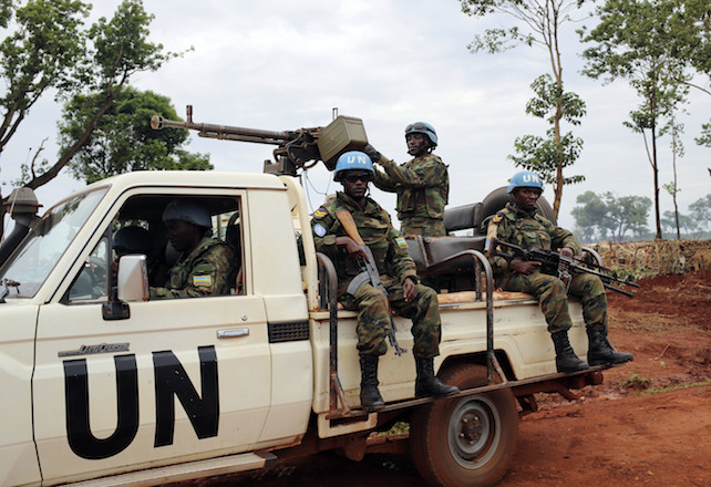 This photo taken Friday May 26, 2017, shows  UN peacekeepers patrolling outside Bria, Central African republic. The U.N. humanitarian agency said the unprecedented violence emptied Bria of its population, sending an “uninterrupted stream” of residents toward makeshift camps.The largest has been set up near the local U.N. base, swelling to over 25,000 people in just two days. (AP Photo/Cassandra Vinograd)