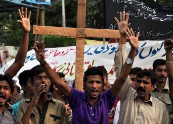 epa04482446 Pakistani members of the Christian minority shout slogans during a protest against the killing of a Christian couple who were burnt alive for alleged blasphemy, in Kot Radha Kishan, in Karachi, Pakistan, 09 November 2014. An angry mob on 05 November, burnt alive Shahzad Masih and his wife Shama Shahzad, a Christian couple in a village in Kot Radha Kishan for allegedly desecrating the Muslim holy book the Koran, police said, in another incident highlighting persecution of religious minorities. Police have arrested around 50 people after the provincial chief minister ordered an investigation into the incident, police said.  EPA/SHAHZAIB AKBER
